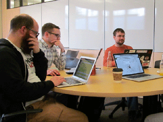 Alan Palazzolo, left, Andrew Dahl, Bill Bushey and Jake Dalton collaborate on analyzing government data at the monthly meetup of Open Twin Cities in Minneapolis.
